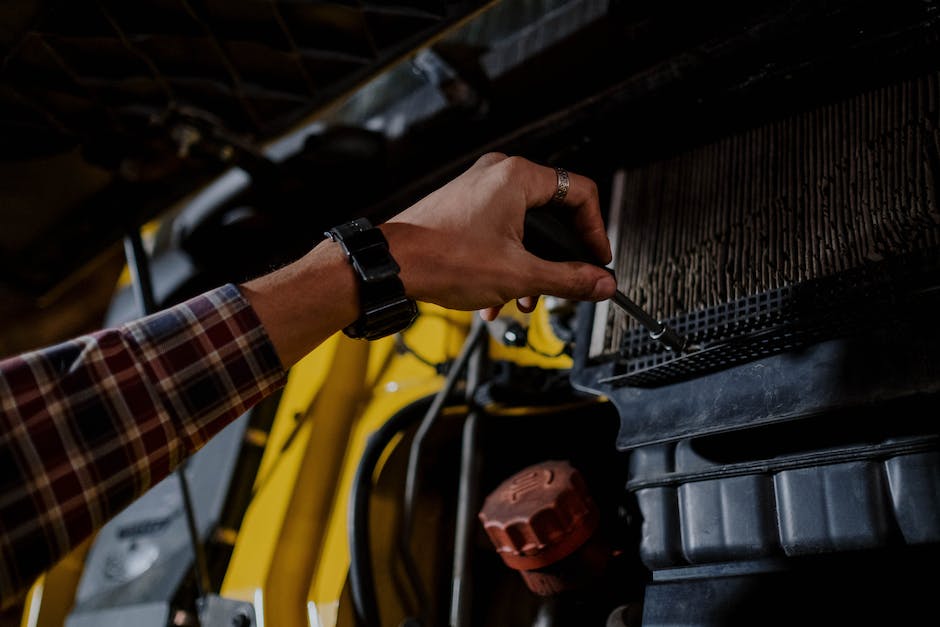 An image showing a person conducting maintenance on a heat pump, ensuring it is free from obstructions, cleaning the air filter, and inspecting electrical connections.