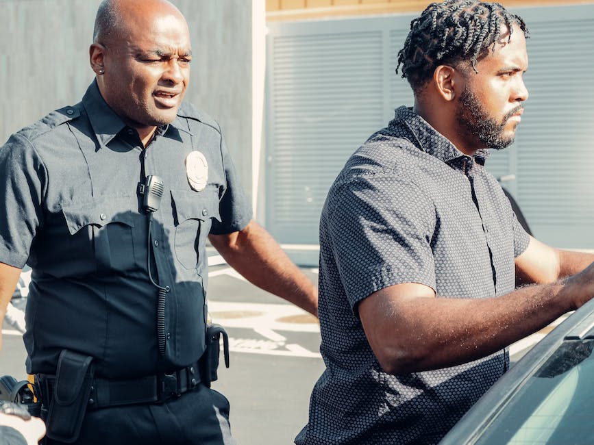 An image showing individuals sitting in a jury box and a judge presiding over a courtroom, representing the topic of the text and the importance of jury duty.