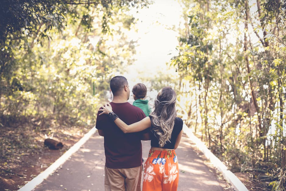 A happy family walking together in a park